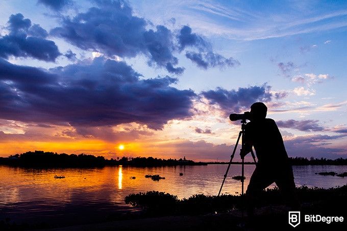 Skillshare Photography: person photographing a sunset.