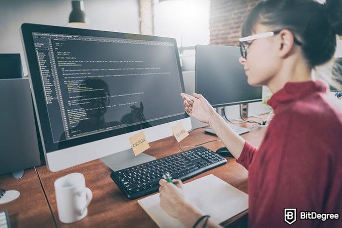 Udacty Intro to Programming: a woman explaining code.