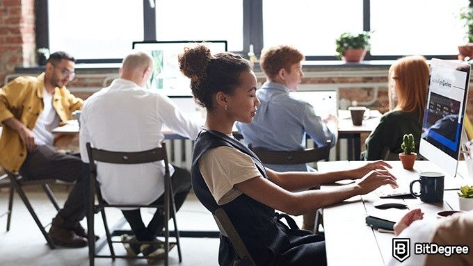 Udemy Python Course: young woman working in an office.