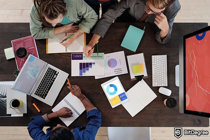 Top Udemy SQL Courses: overhead shot of a meeting.