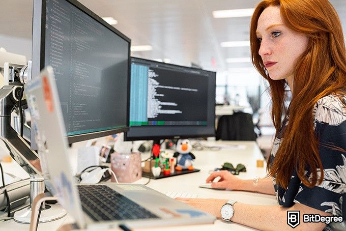 Top Udemy SQL Courses: young woman coding.