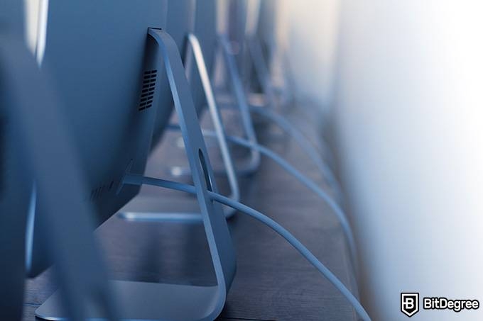 Engineering online degree: a row of monitors from behind.