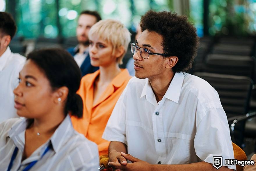 Public speaking classes online: students are listening to a public speaker.