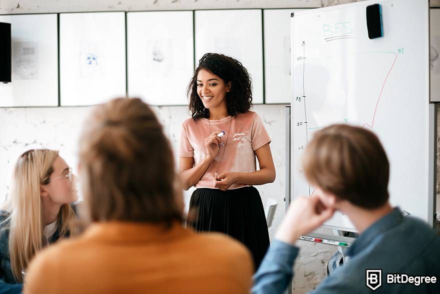 Public speaking classes online: a woman is speaking during a group meeting.