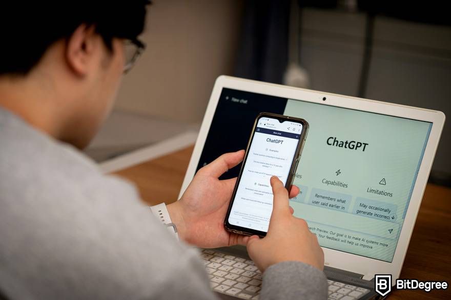Where to learn ChatGPT: a man is using the ChatGPT software on his phone and laptop.